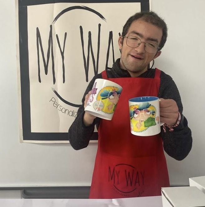 TAO student presenting personalised mugs from the My Way workshop