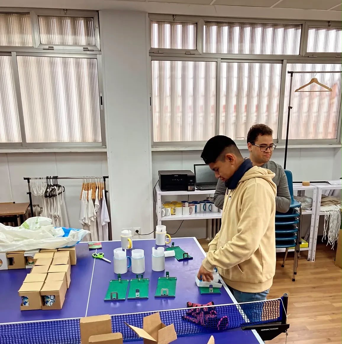 TAO students packaging mugs in the My Way workshop