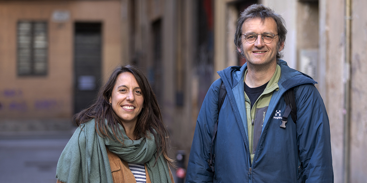 Two people pictured on a street in Barcelona, photograph from Arrels Fundació